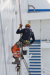 construction worker on ladder