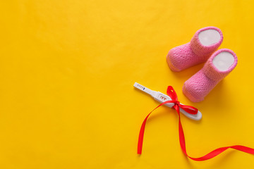 Baby socks for girls and pregnancy test.