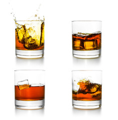 Three glasses with whiskey pouring into them