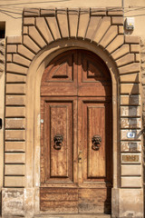 Fototapeta na wymiar Old wooden door Florence, Italy