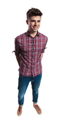 Fototapeta premium smiling man wearing a red plaid shirt looks to side