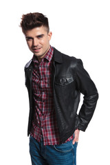 portrait of smiling man wearing plaid shirt and leather jacket