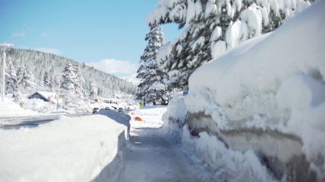 Snowy walkway next to a busy highway for background plate