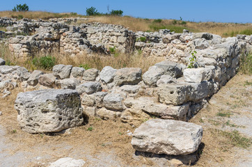 Fototapeta na wymiar The ruins of the ancient city. Russia, the Republic of Crimea, the city of Sevastopol. 11.06.2018: The ruins of the ancient and medieval city of Chersonese Tauride
