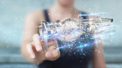 Businesswoman using wireframe holographic 3D digital projection of an engine