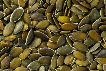 Macro background texture of green pumpkin seeds