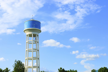 water tank concrete tower with the sky on background