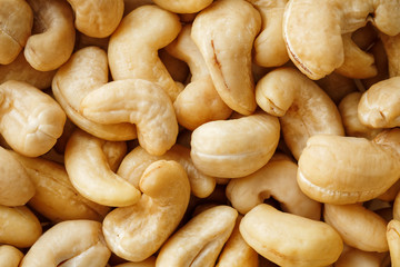Cashew with no shell on a background. Macro nuts, Organic vegan food.