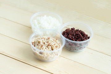 Three kinds of cooked rice in plastic bowl