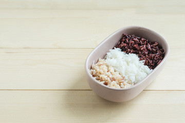 Mix of cooked rice in ceramic oval bowl