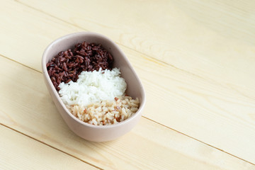 Mix of cooked rice in ceramic oval bowl