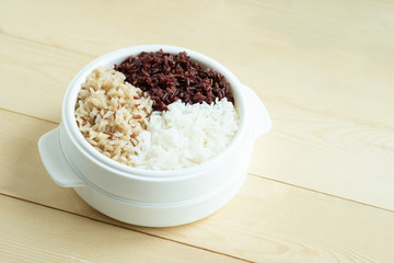 Mix of cooked rice in plastic bowl