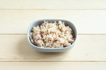 Organic brown rice in ceramic bowl