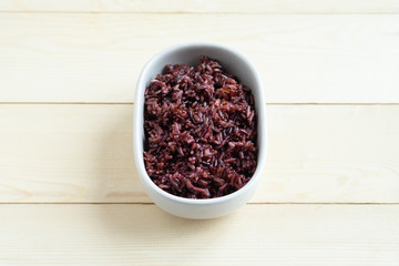 Organic riceberry in ceramic bowl