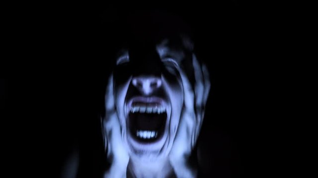 Scary evil many faces. Devil spiritual exorcism. Portrait of a mentally ill mad man.