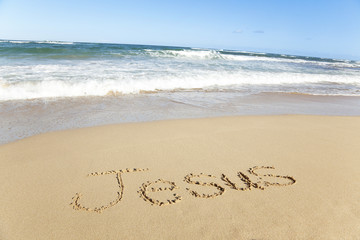 word written in sand on the beach