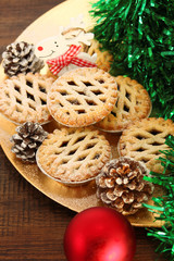 Christmas mince pies on a wooden background
