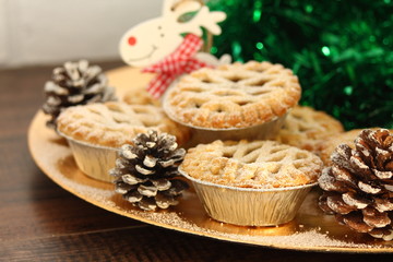 Christmas mince pies on a wooden background
