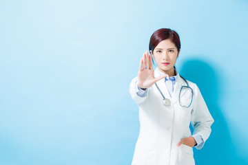 woman doctor show stop gesture