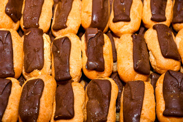 Éclair, choux dough filled with a cream and topped with chocolate icing