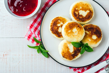 Cottage cheese pancakes, syrniki in a white plate, Gourmet Breakfast 