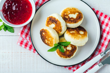 Cottage cheese pancakes, syrniki in a white plate, Gourmet Breakfast 