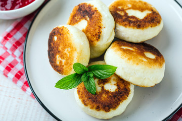 Cottage cheese pancakes, syrniki in a white plate, Gourmet Breakfast 