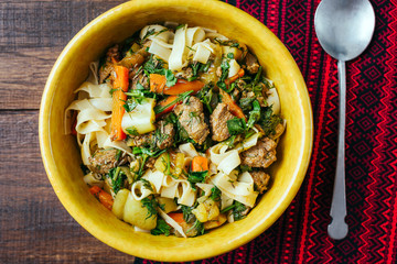 Lagman, Central Asian national dish with lamb, long noodles and vegetables