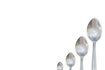 isolated steel teaspoon order by size (small to big) on white background have copy space for put...