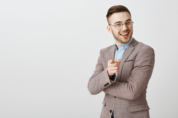 Your ideas promising. Pleased and delighted smart businessman in trendy formal jacket and glasses...