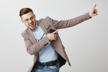 Boosting mood and confidence with right track. Delighted good-looking joyful man with bristle in...