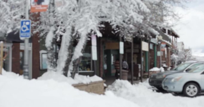 A small mountain store with large mounds of snow for background plate