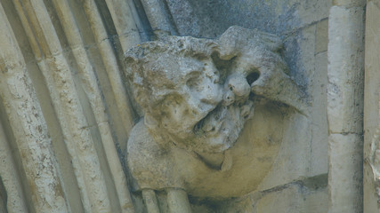 Corbel Head on The West Front of Salisbury Cathedral H, Gargoyle on Early English Gothic Cathedral, shallow depth of field split toning horizontal photography © Jacek Wojnarowski