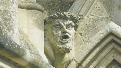 Corbel Head on The West Front of Salisbury Cathedral I, Gargoyle on Early English Gothic Cathedral, shallow depth of field split toning horizontal photography © Jacek Wojnarowski