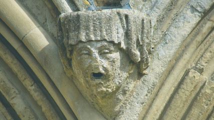 Corbel Head on The West Front of Salisbury Cathedral J, Gargoyle on Early English Gothic Cathedral, shallow depth of field split toning horizontal photography © Jacek Wojnarowski