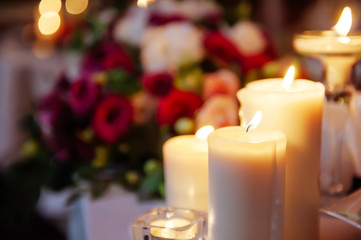 A blurred picture of candles burning