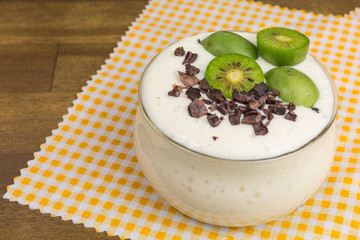 soy bean curd dessert with mini kiwi and cocoa nibs