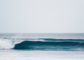 Fototapeta premium Wave after wave barreling