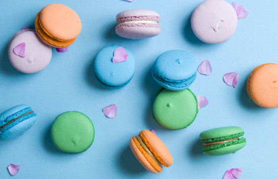 Delicious colorful cookies on a blue background