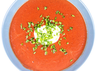 Beetroot cream soup decorated with yogurt and chives