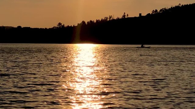 Sunset with orange tones on the river Zezere. Portugal.