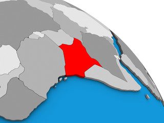 Kenya on simple blue political 3D globe.