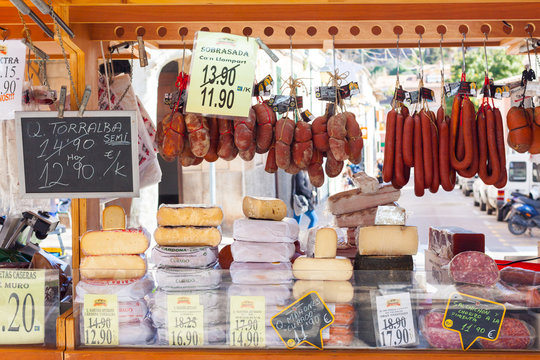 Traditional Majorcan Sobrassada saussage and Mahon cheese for sale at a local market in Esporles, Mallorca, Spain