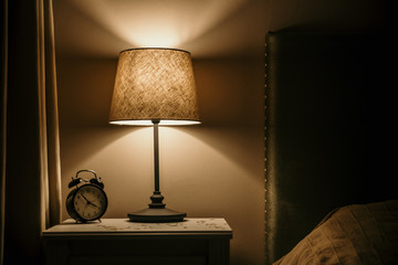 night light and alarm clock on the bedside table