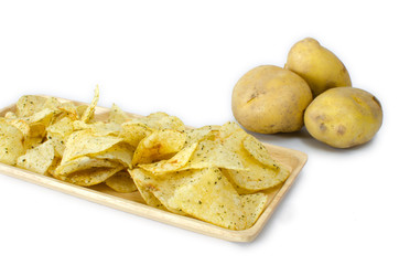 fried cripy potato on wood plate and three potato on white background,