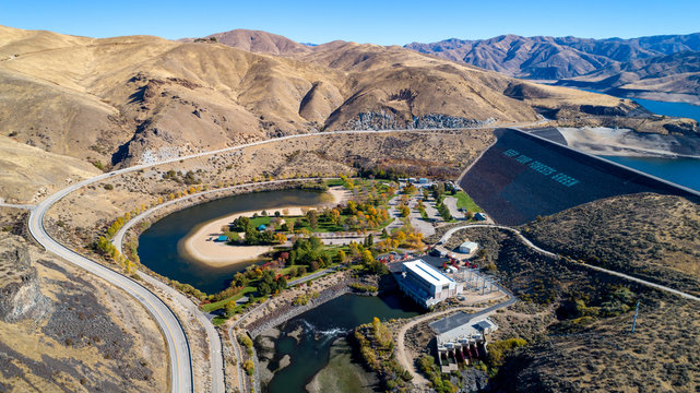 Aerial view of the dam on the Boise River in the fall time where the water behind is low