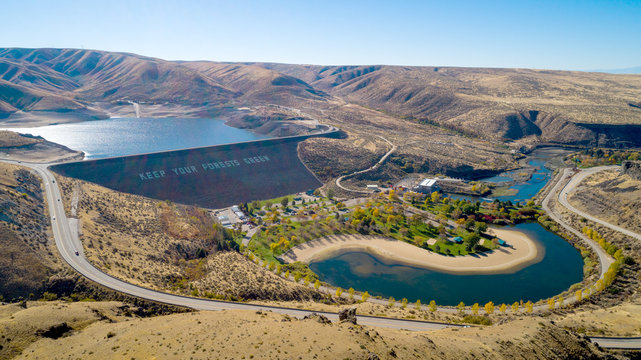 Earthen Dam in the Boise River and public park with fall colored trees