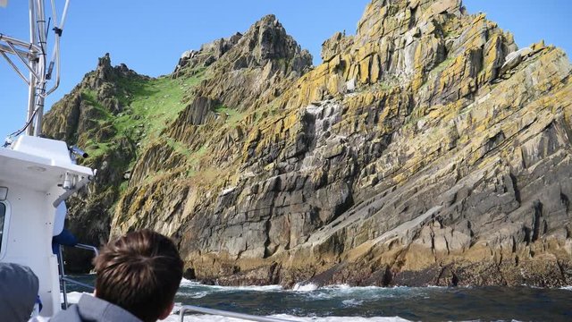 Approaching the island Skellig Michael in Ireland with a boat