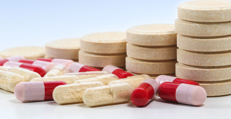 Fototapeta na wymiar Bunch of tablets and probiotics and antibiotics capsules