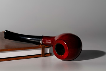 briar pipe and a book